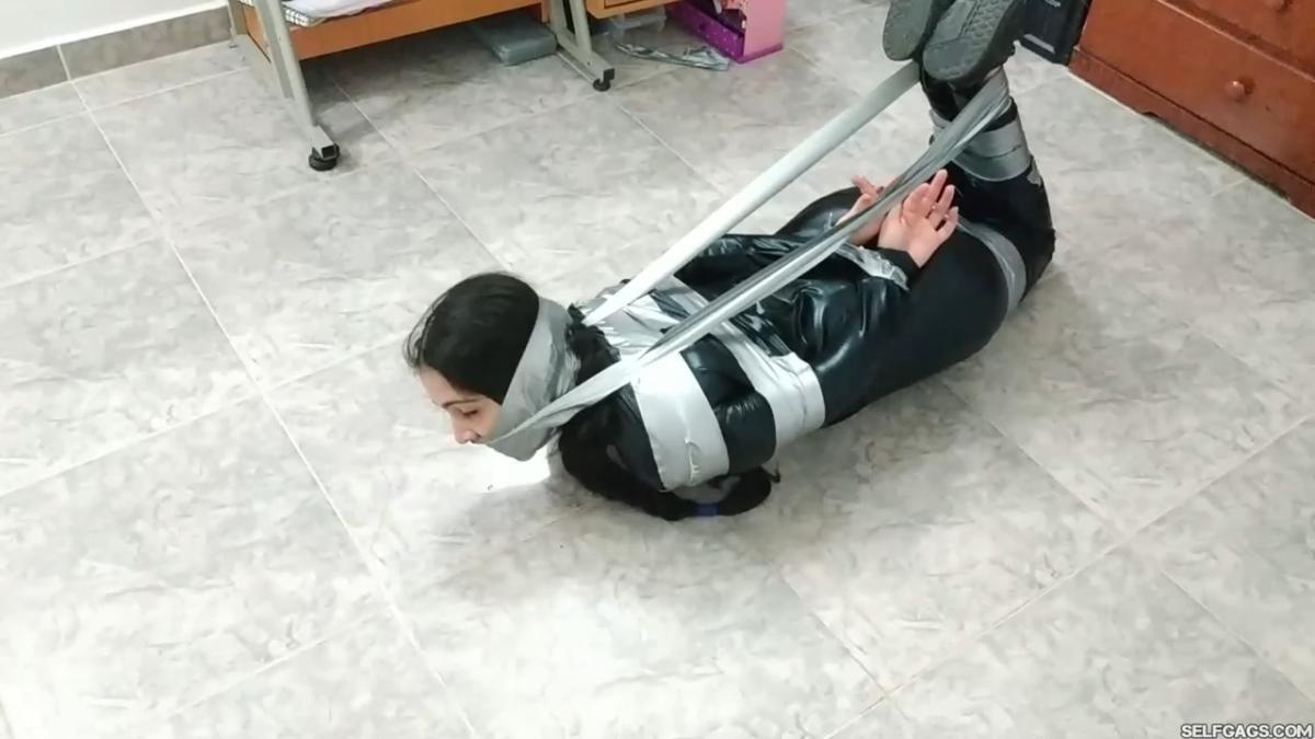 Catsuit girl in bondage