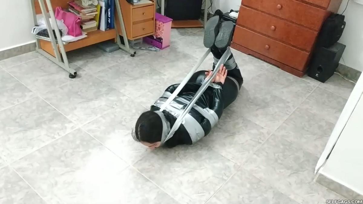 Catsuit girl in bondage