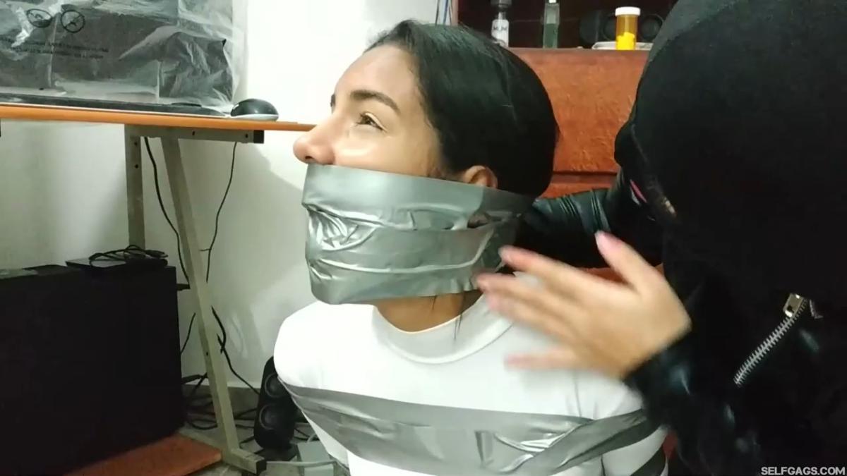 Catsuit girl in bondage
