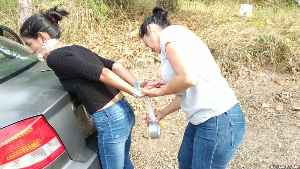 Tresspassing-Girls-Bound-And-Gagged-Outside-3