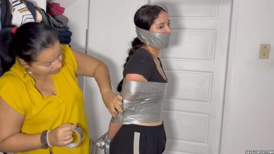 Defiant Nana getting her torso tightly wrapped in silver duct tape by Lau Selfgags