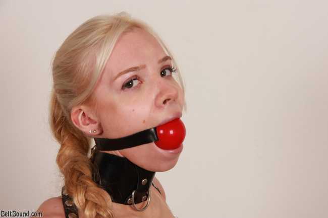 Young BDSM girl wearing huge ballgag