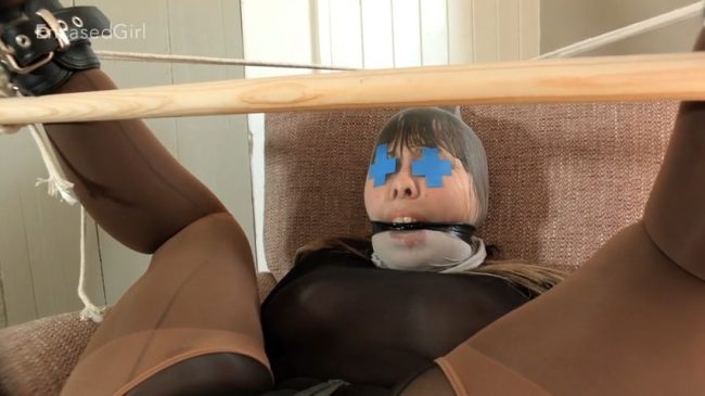 Cherry-English-Nylon-Hooded-Cuffed-Wooden-Stick-In-Exposed-Pussy-EncasedGirl-9