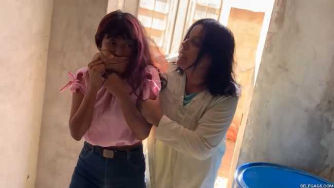 Curious-Sisters-Rope-Bound-And-Tape-Gagged-By-Crazy-Woman-In-Abandoned-House-2