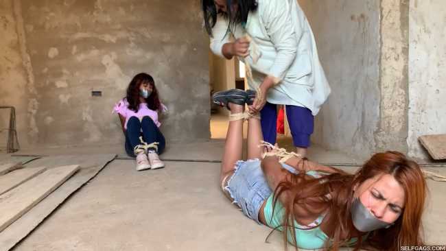 Curious-Sisters-Rope-Bound-And-Tape-Gagged-By-Crazy-Woman-In-Abandoned-House-2