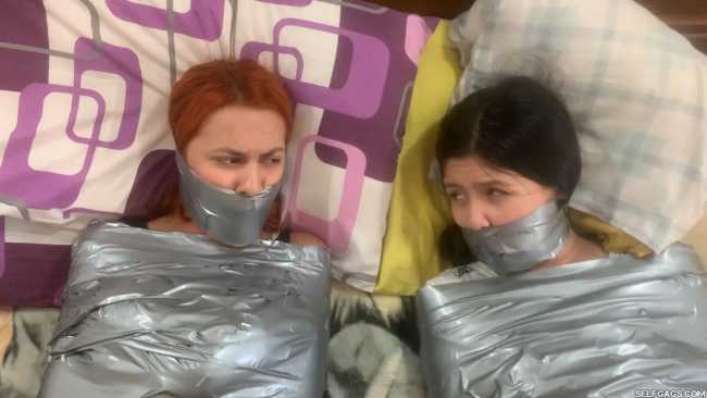 Angry girls gagged in tight duct tape mummification bondage
