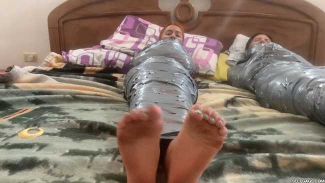 Barefoot girls gagged in tight duct tape mummification bondage