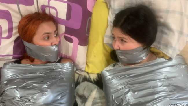 Mummified girls gagged in duct tape bondage