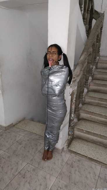 Duct-Tape-Mummified-Girl-With-Face-Hooks-5