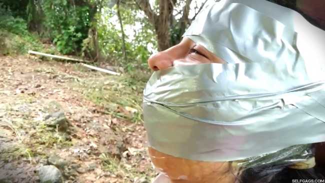 Female-Detective-Bound-And-Gagged-Outdoors-By-Criminal-MILF-Villan-10