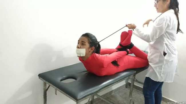 Female-patient-treated-with-bondage-by-doctor-11