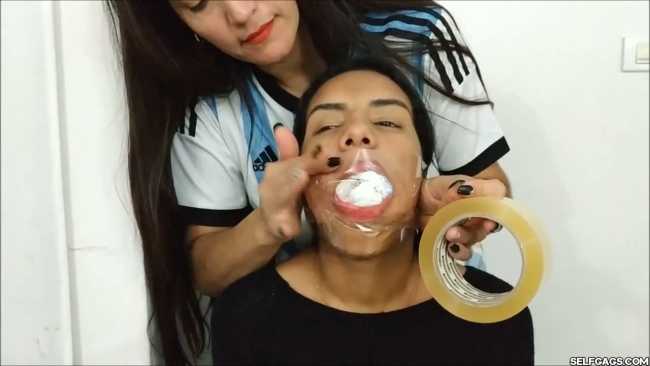 Gagged-With-Clear-Tape-Mouth-Stuffed-With-Multiple-Socks-25