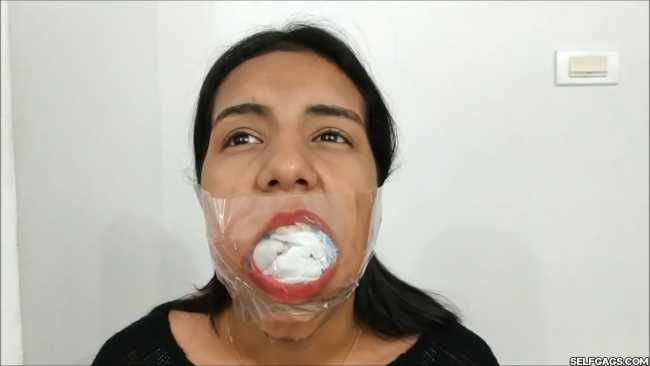 Gagged-With-Clear-Tape-Mouth-Stuffed-With-Multiple-Socks-30