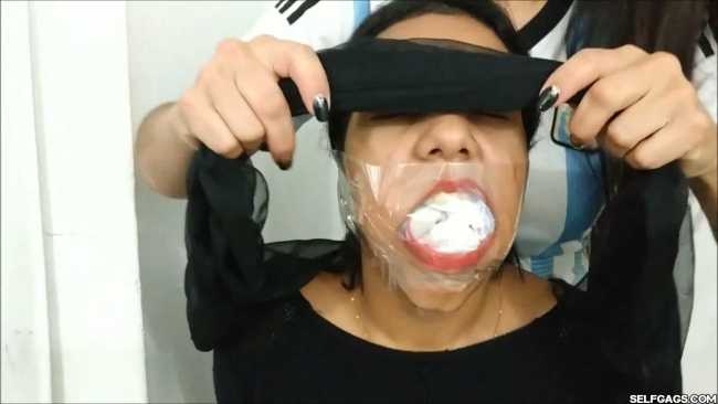 Gagged-With-Clear-Tape-Mouth-Stuffed-With-Multiple-Socks-33