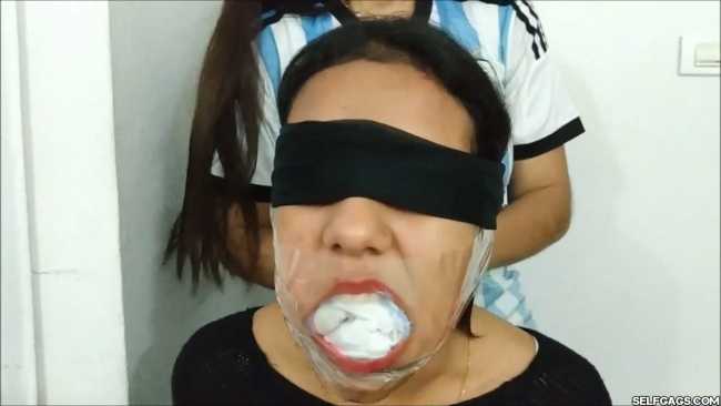 Gagged-With-Clear-Tape-Mouth-Stuffed-With-Multiple-Socks-35