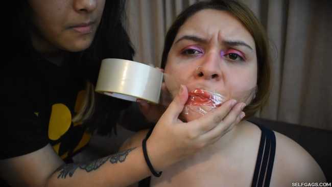Girl-Gagged-With-Clear-Tape-And-Made-To-Smoke-Cigarette-1