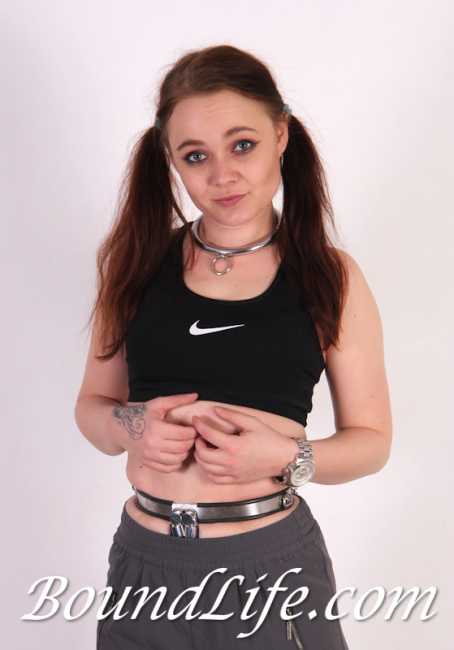 Girl Wearing Metal Collar And Chastity Belt