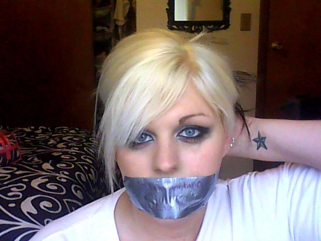 Girl-gagged-with-duct-tape-and-crying