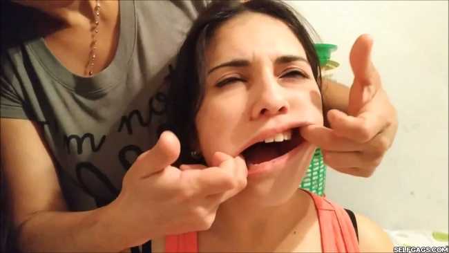 Girl has her mouth gagged with many socks