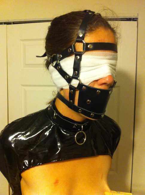 Muzzle-gagged-bondage-slave-blindfolded-and-topless