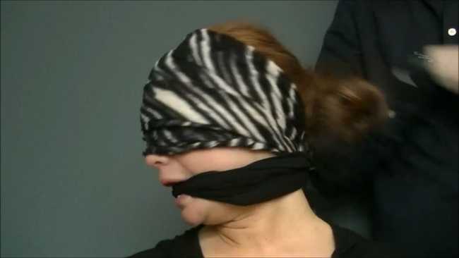 Blindfolded college girl gagged