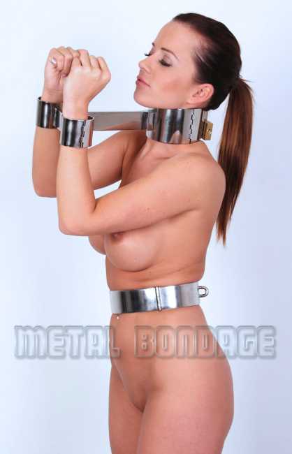 Redhead in metal bondage