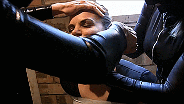 Snooping-Reporter-Bound-And-Gagged-By-Catsuit-Women-13