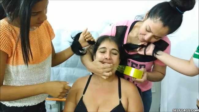 Latina woman turned gagged slut by three lesbian women