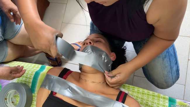 Gagged girl put in bondage by her nannies