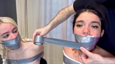 Both cuties silenced under tape with chair bondage readable