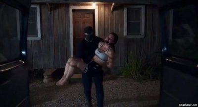 Masked captor carrying bound and ballgagged sporty girl in sports bra and shorts out of house at night toward dark van